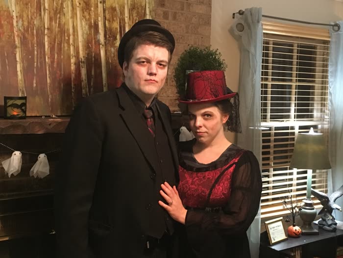 Mysterious hosts of a live escape room in costume