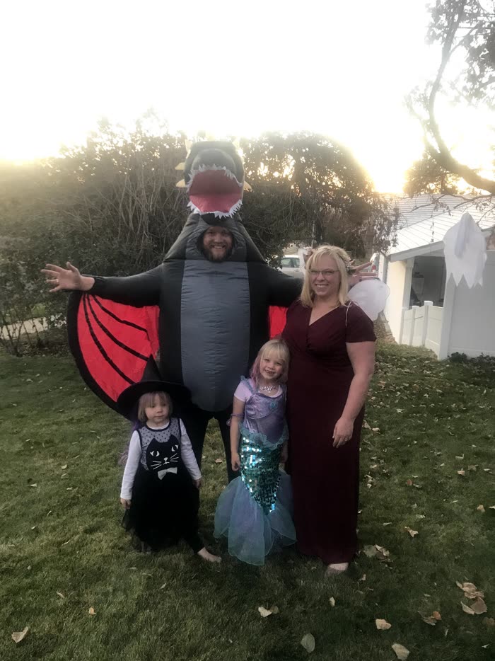 Dragon costume and mermaid at a backyard party